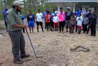 a biologist teaches a class called Python Patrol to members of the public